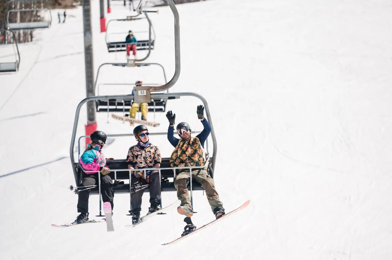 People enjoying riding the chairlift