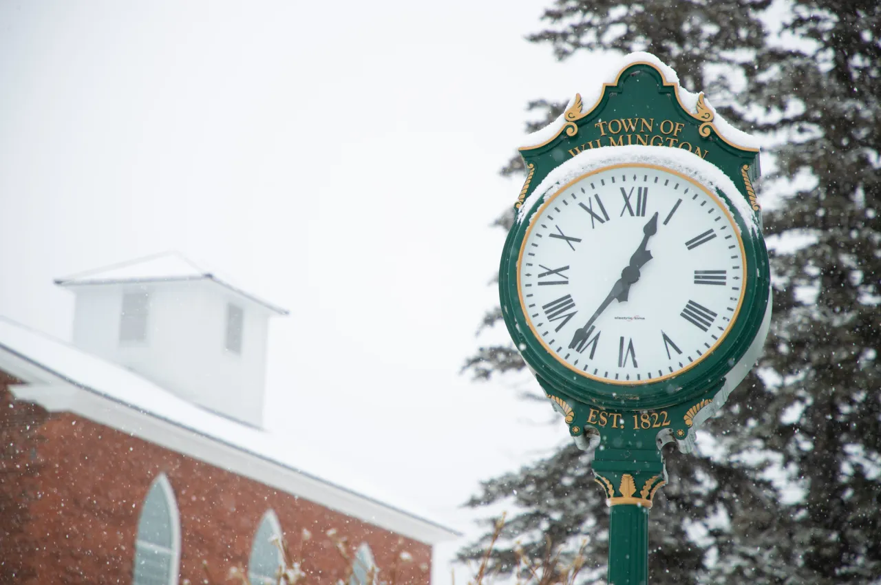 Snow-covered green clock