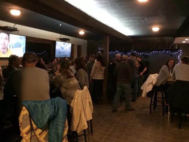 The bar was filled with groups of friends having a blast.