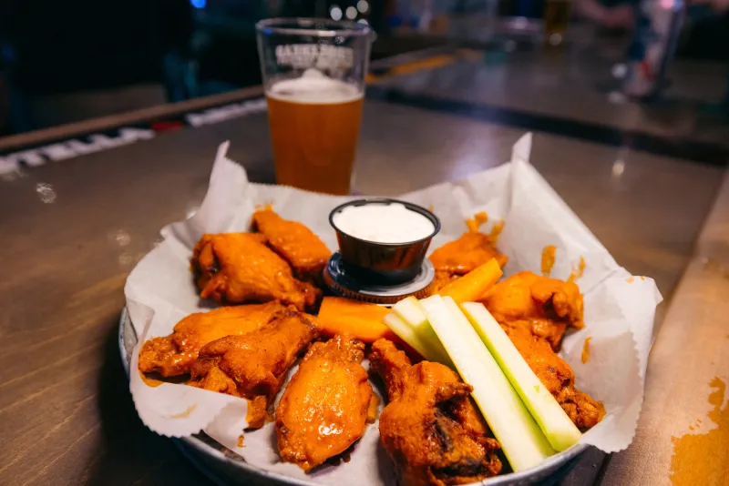 Plate of hot chicken wings at Twisted Raven