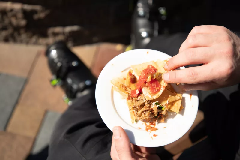 Nachos on a plate at outdoor dining.