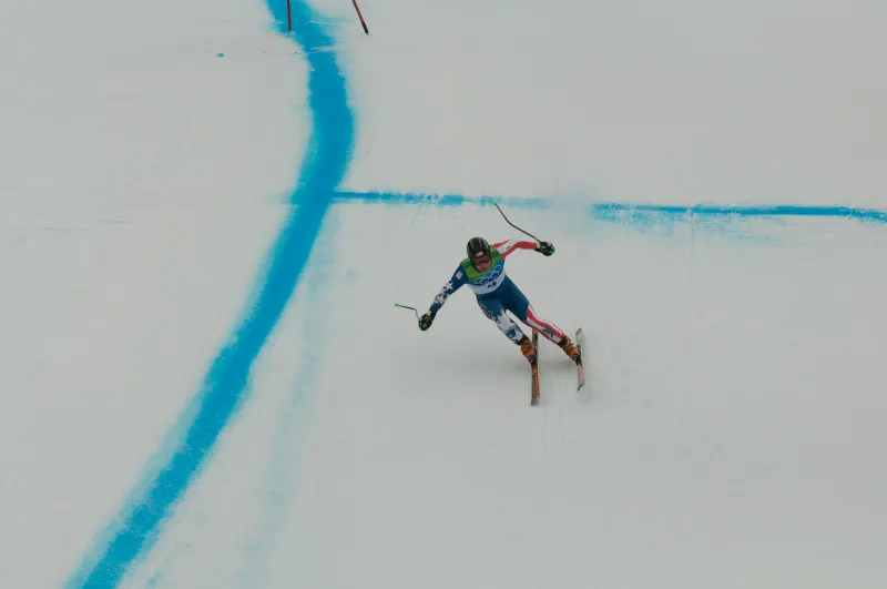 An Olympic skier on a steep course.