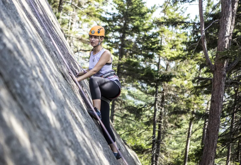 A climber focuses on the next hand hold