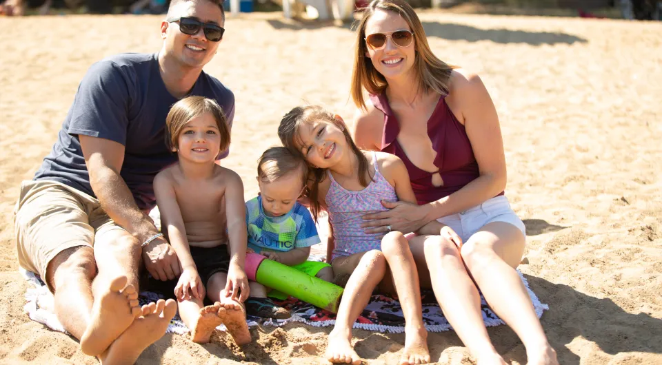 A family sits on the beach 